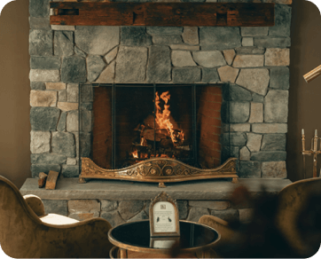 Stone-built ﬁreplace with a wood-burning ﬁre, creating a rustic and welcoming environment in Stateline, CA.